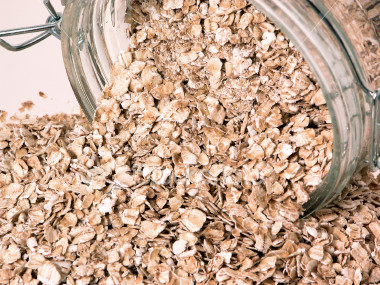 ist2_325481-container-of-spilt-raw-oats-on-table.jpg